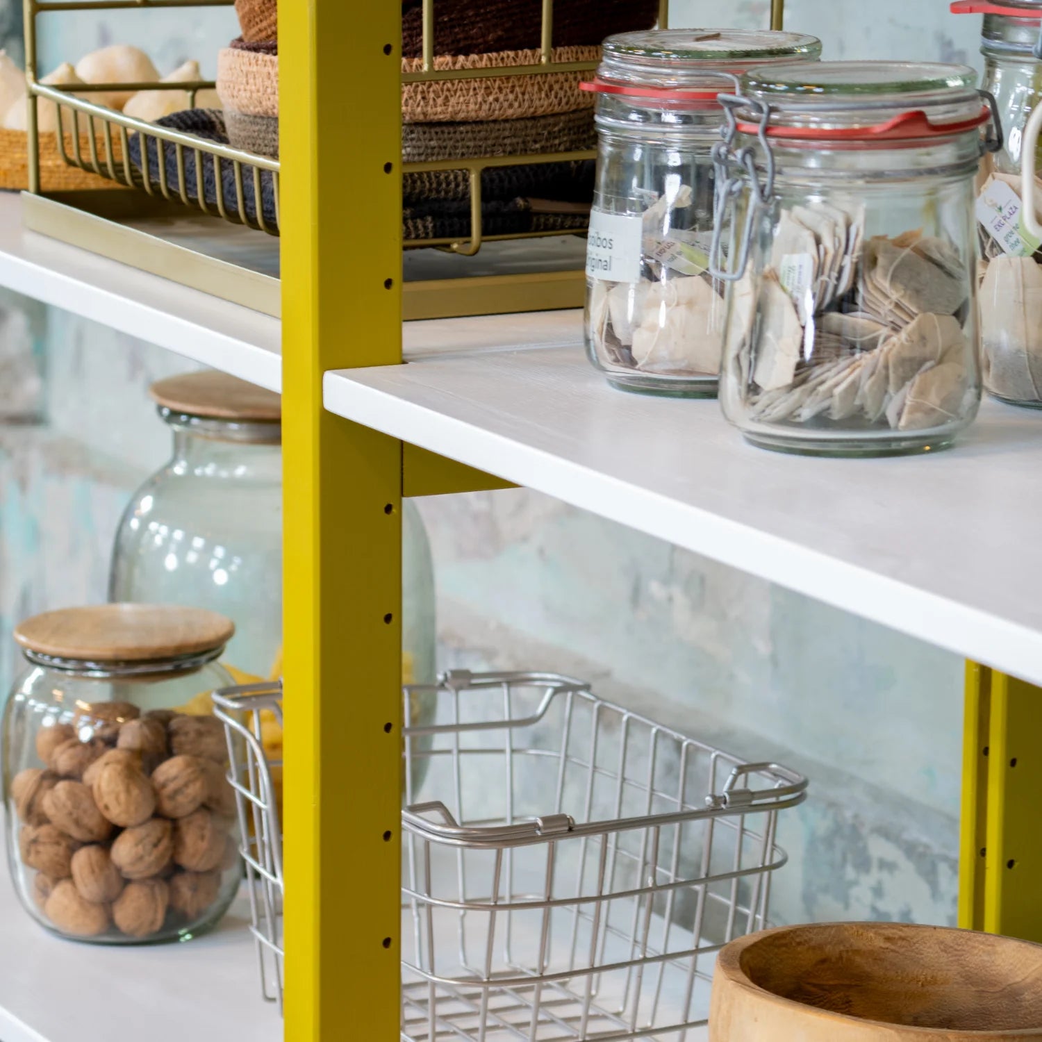 Low bookcase detail | Lundia Original | Mustard Green solid wood upright with wire baskets