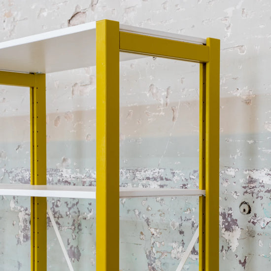 Low bookcase detail | Lundia Original | Mustard Green solid wood upright with white shelf