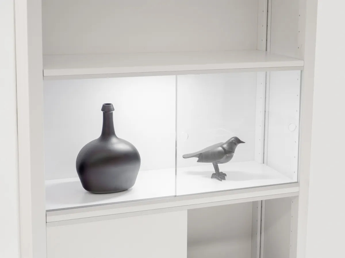 Stylish presentation in a wooden display cabinet with glass doors